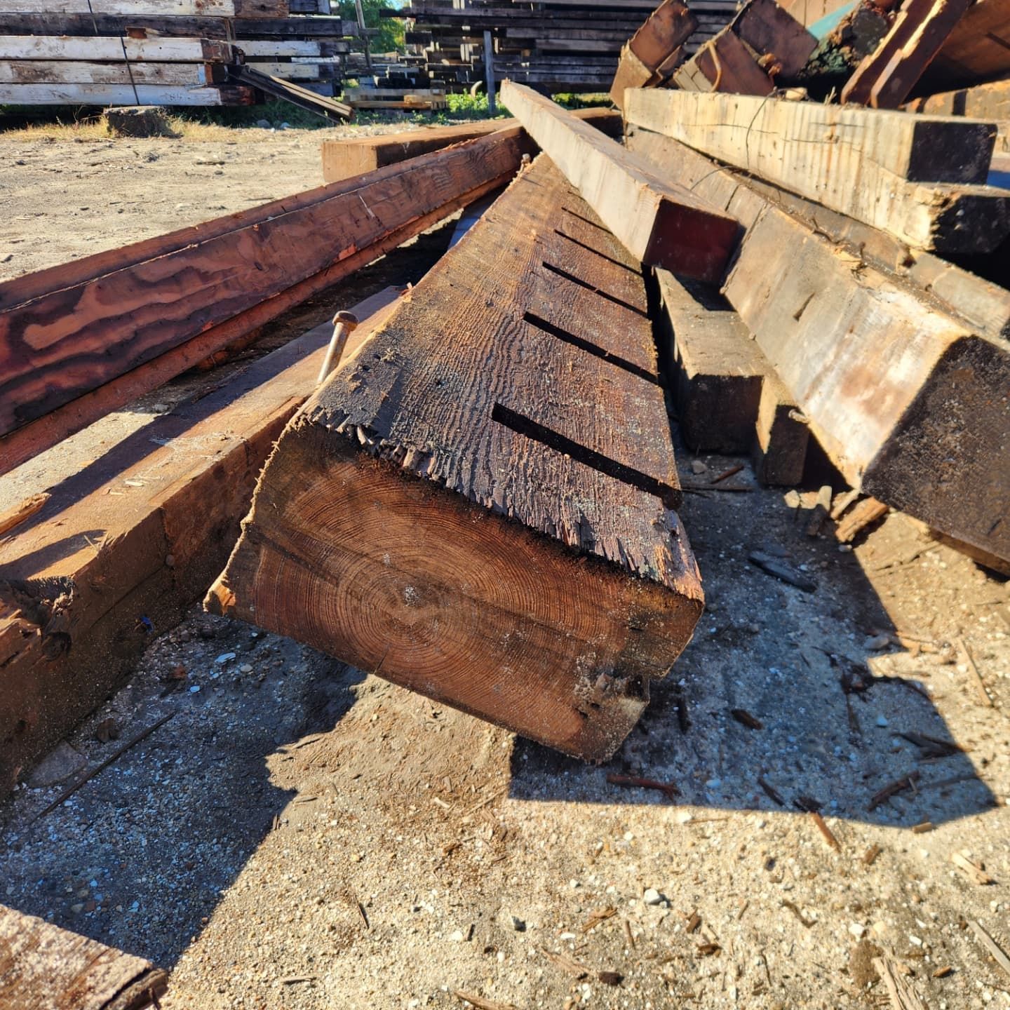 A pile of wood is laying on the ground