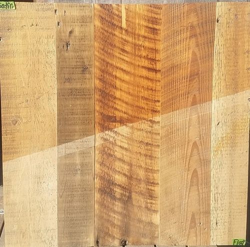 A close up of a piece of wood with the word floor on it