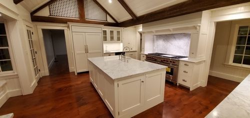 There is a large island in the middle of the kitchen.