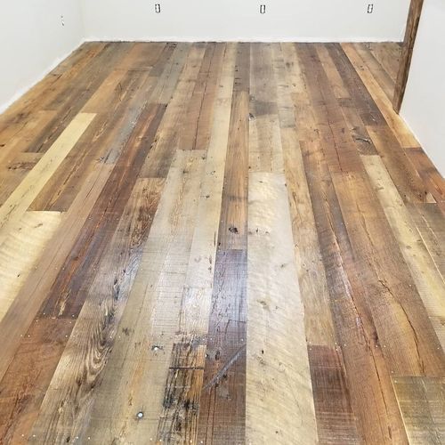 A room with a wooden floor and white walls