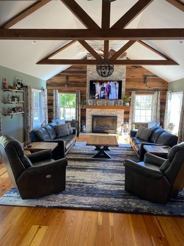 A living room filled with furniture and a fireplace.