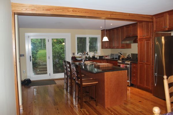 A kitchen with stainless steel appliances and wooden cabinets