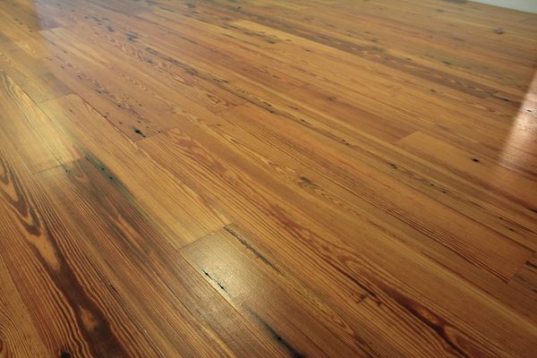 A close up of a wooden floor in a room.