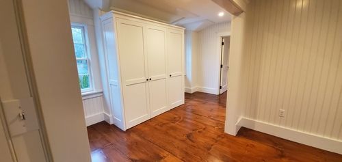 There is a large closet in the middle of the room.