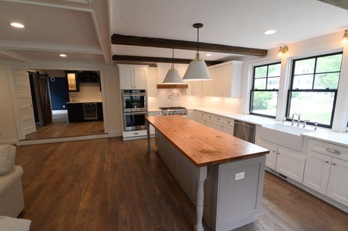 There is a large island in the middle of the kitchen.