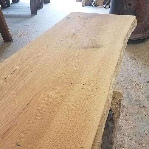 A piece of wood is sitting on the floor in a room.