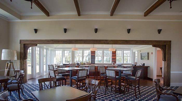 A large room with tables and chairs in it