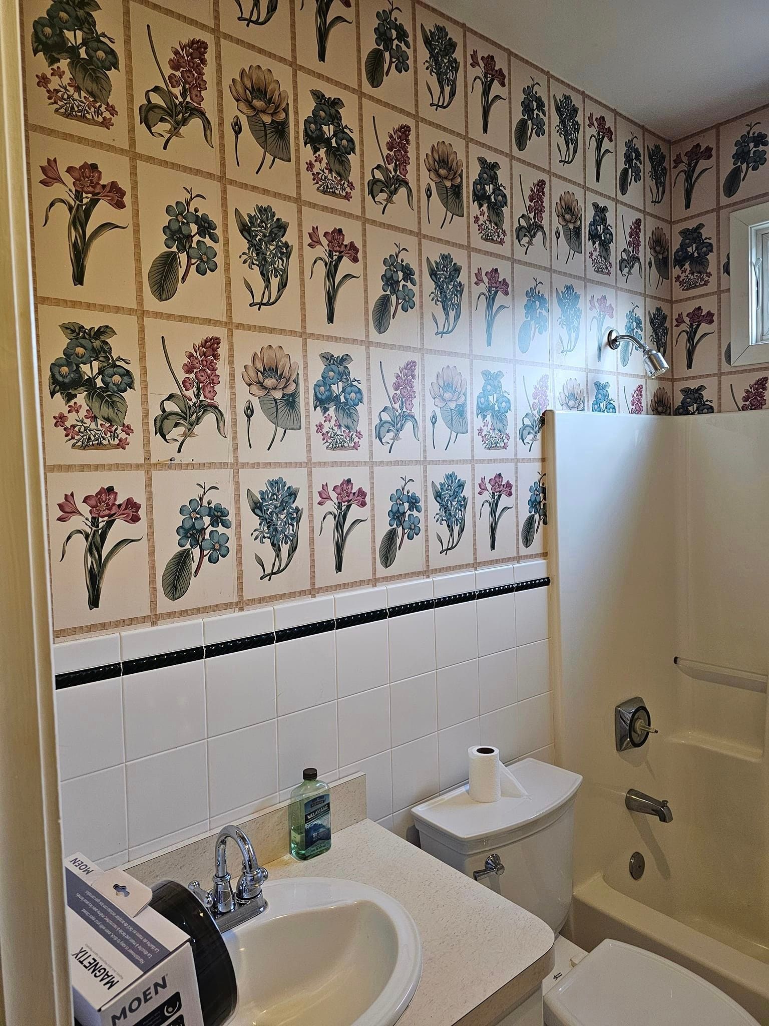 A bathroom with a lot of tiles on the wall