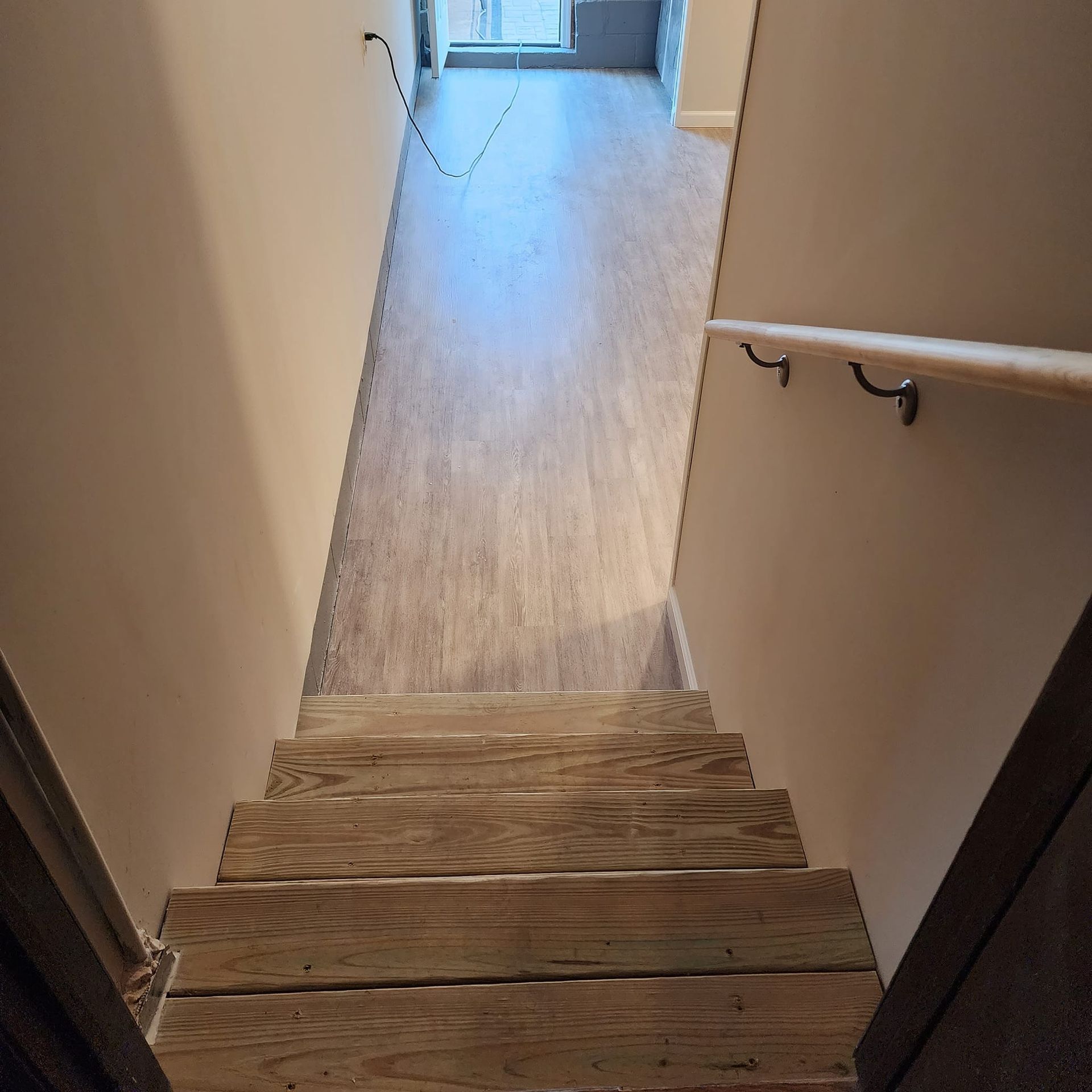 A wooden staircase leading up to the second floor of a house