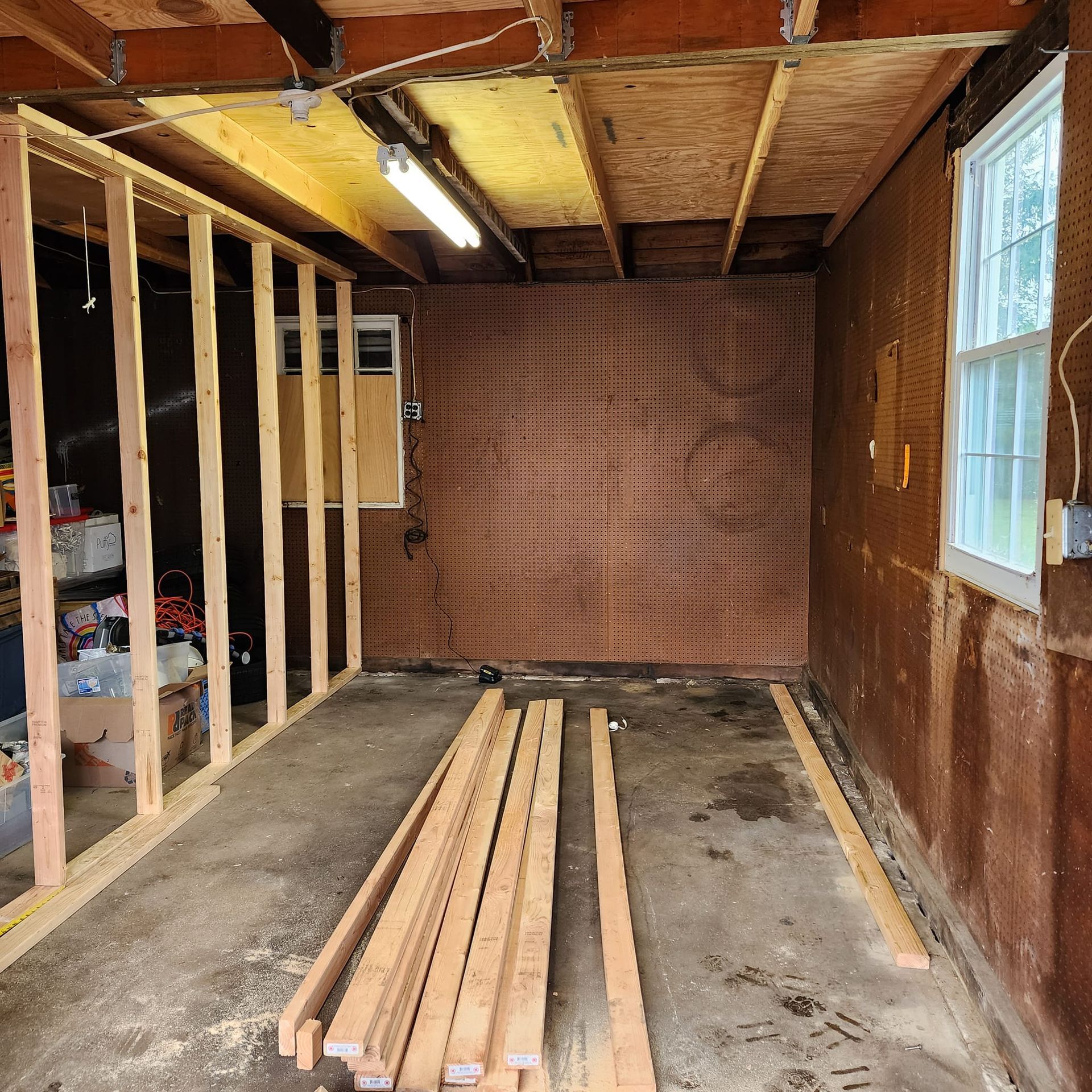 A room with a lot of wood in it and a window