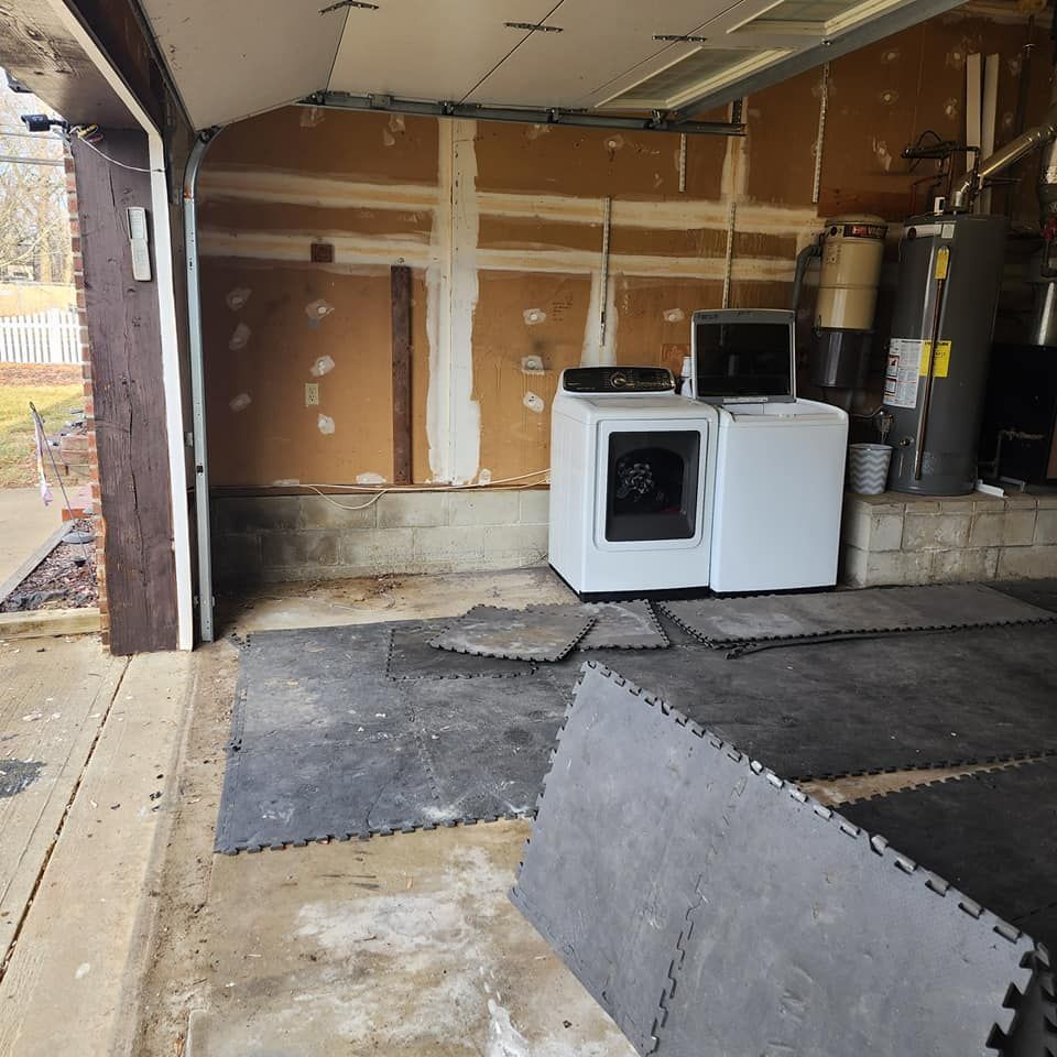 A laundry room with a washer and dryer in it