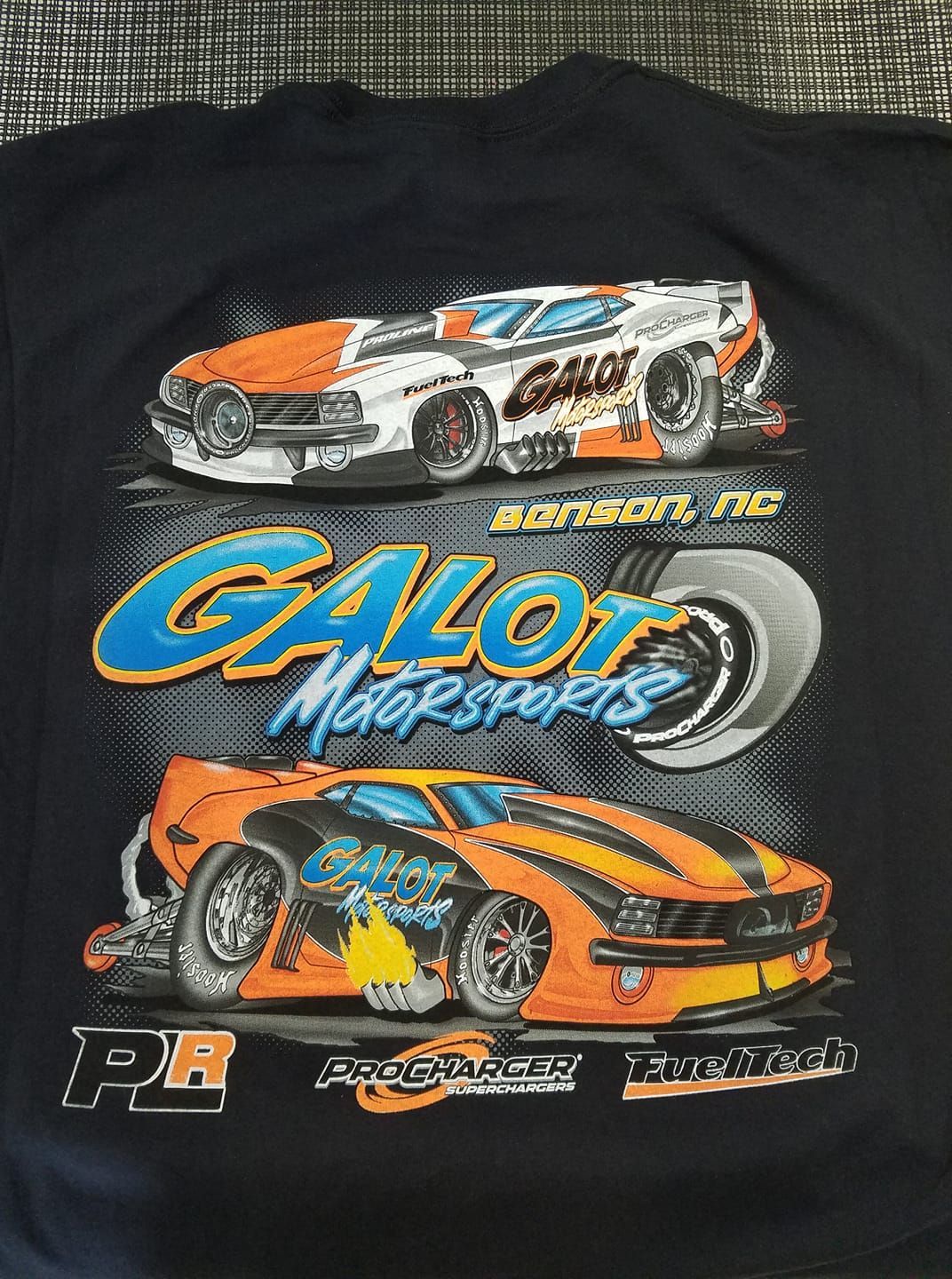 A black t-shirt with two race cars on it