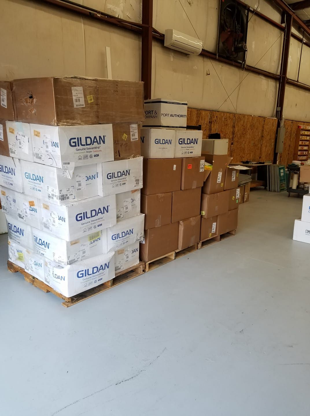 A warehouse filled with lots of boxes stacked on top of each other.