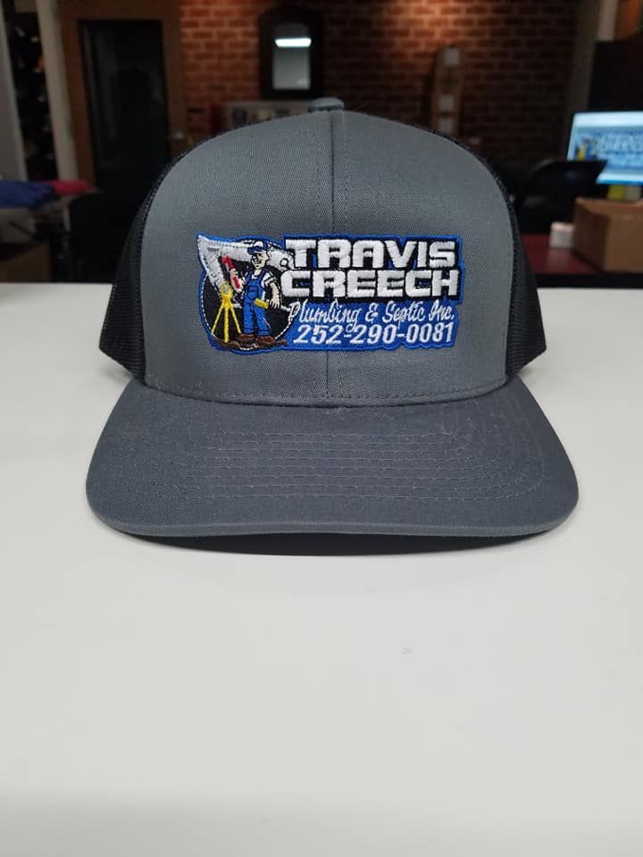 A hat with a logo on it is sitting on a table.