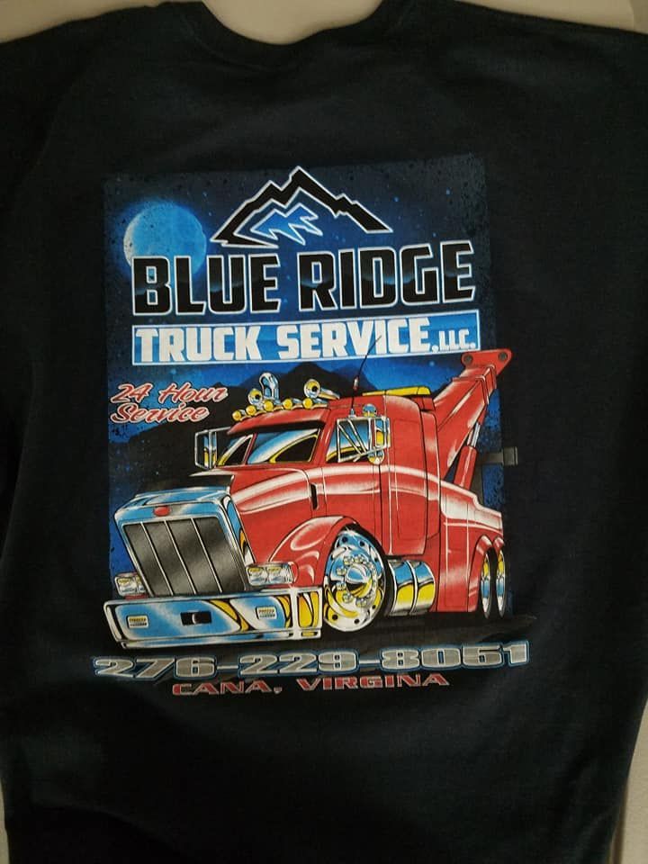 A blue ridge truck service t-shirt with a red truck on it