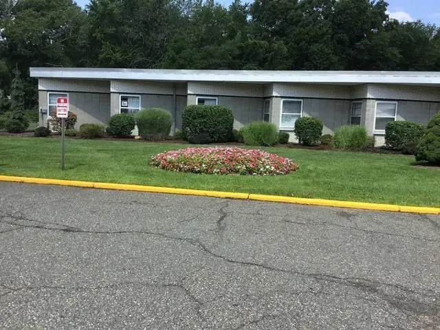 A building with a no parking sign in front of it