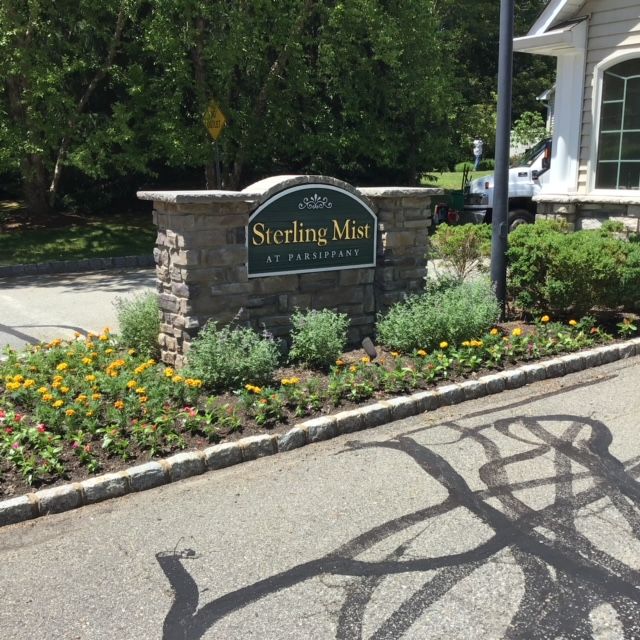 A sign for sterling mist sits on the side of the road