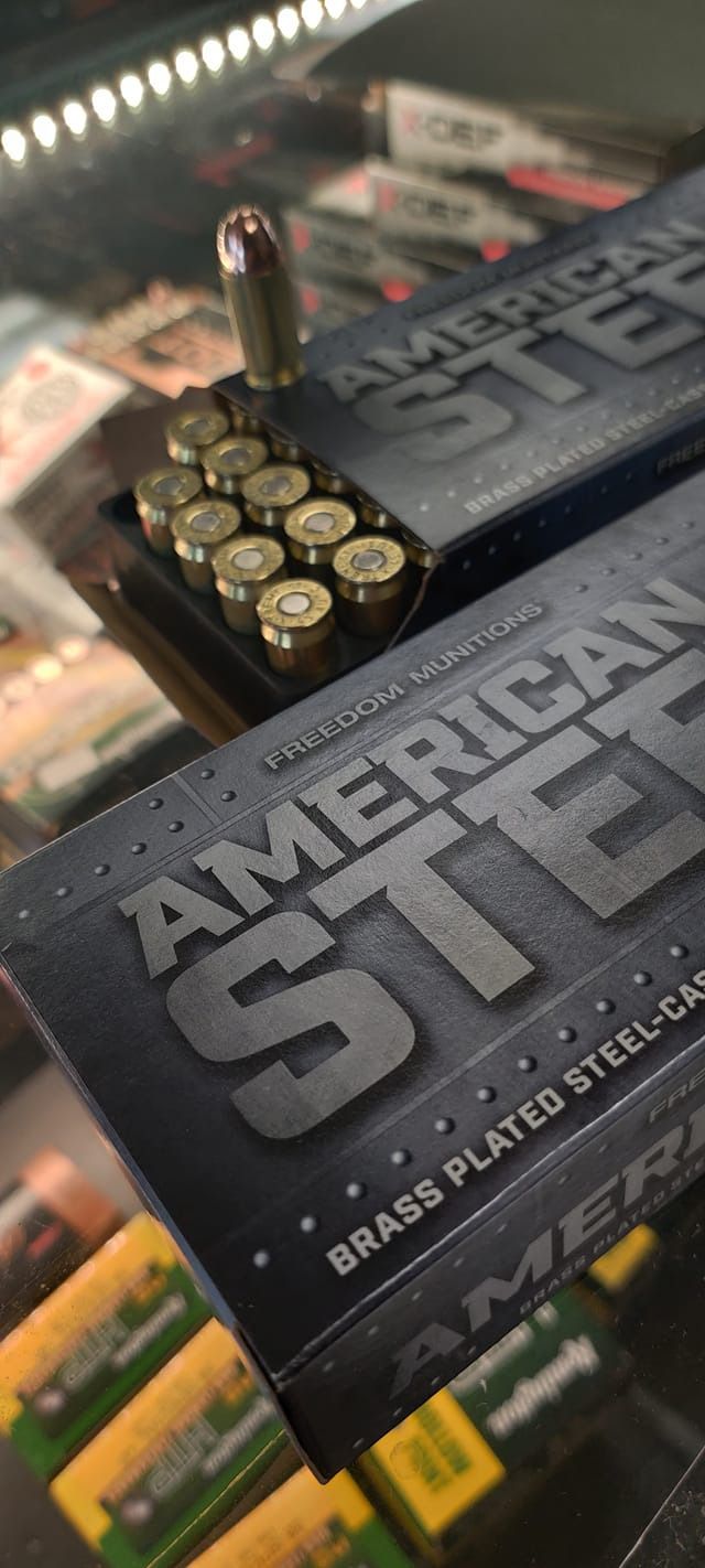 A close up of a box of american steel brass plated steel bullets.