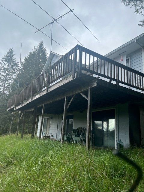 home before the deck and siding replacement