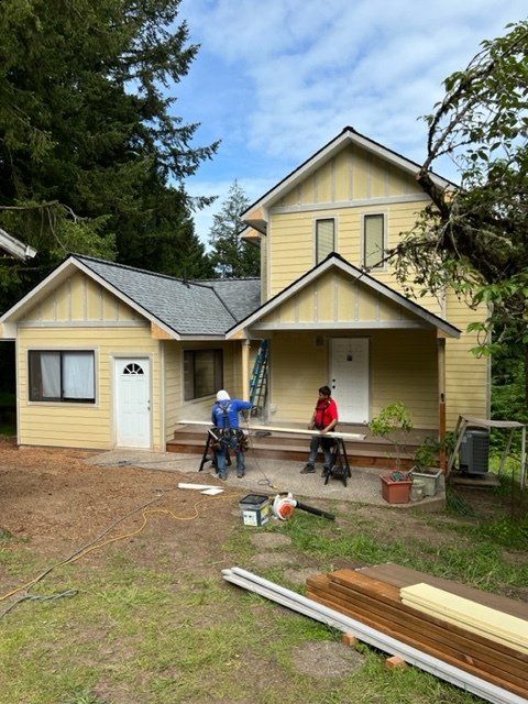 men preparing the wood for the deck