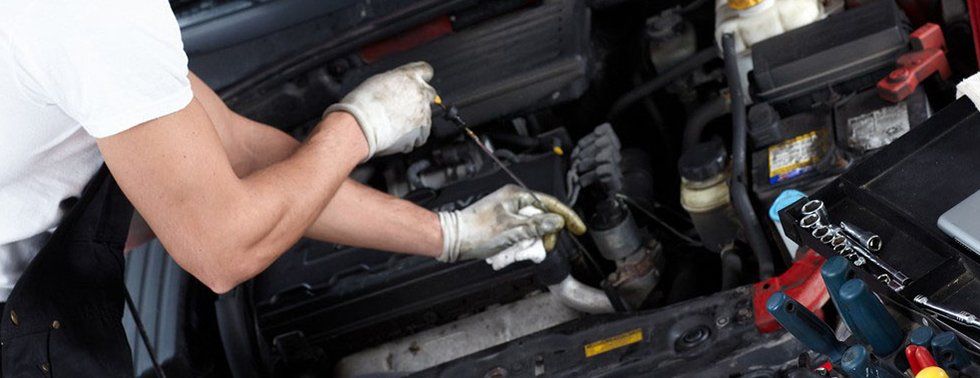 mechanic fixing a car engine