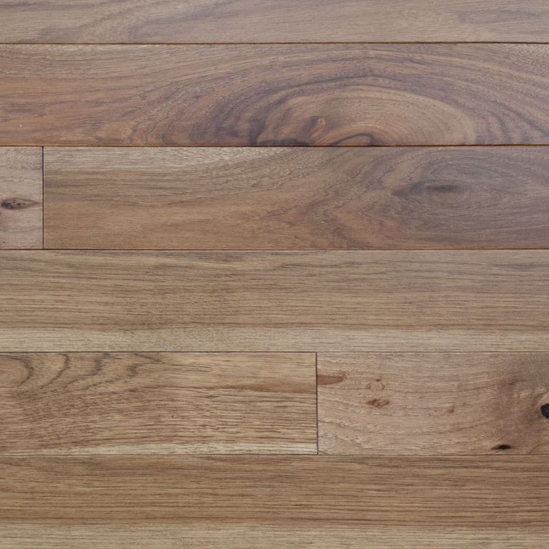 A close up of a wooden floor with a grain and texture.