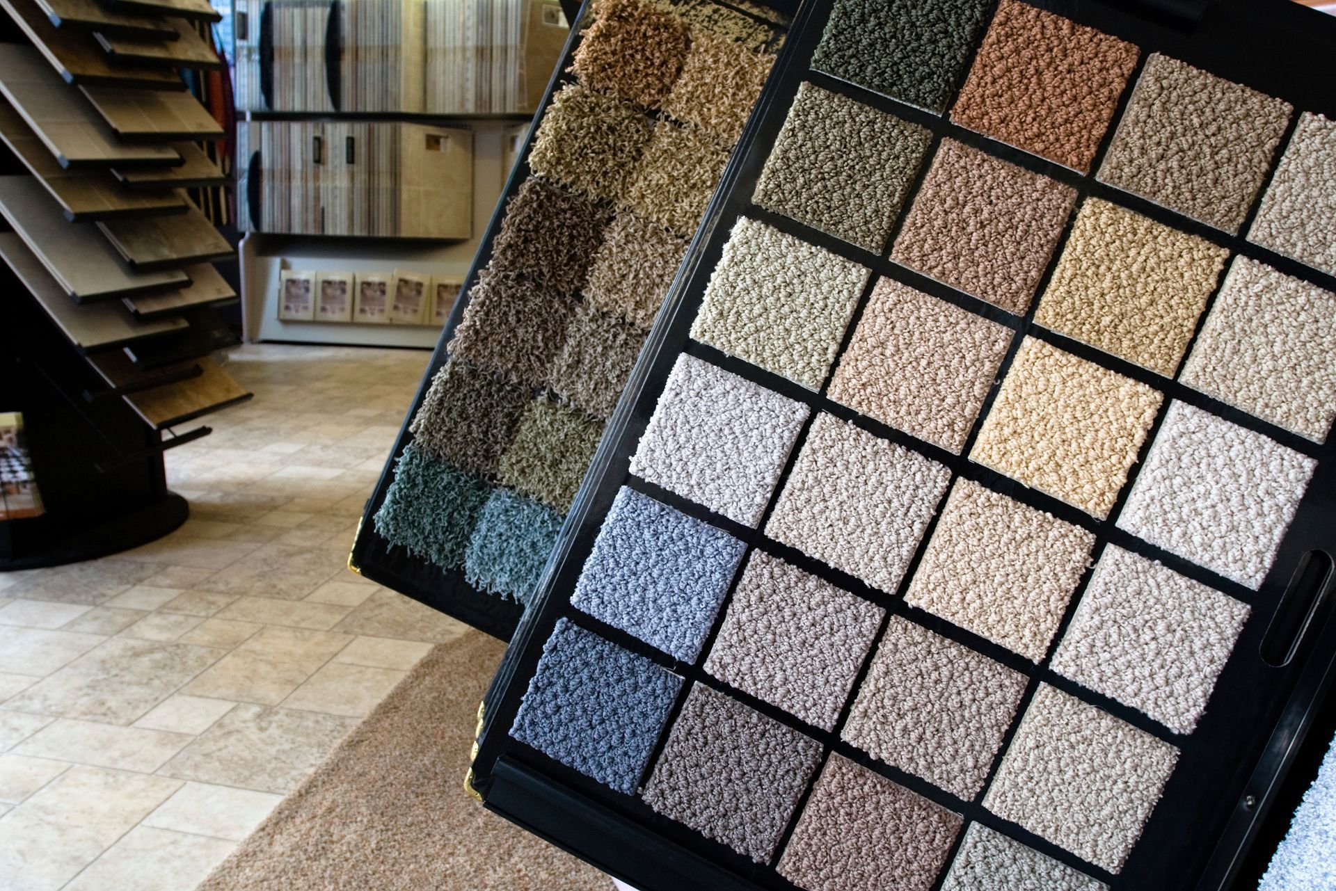 A variety of carpet samples are displayed in a store