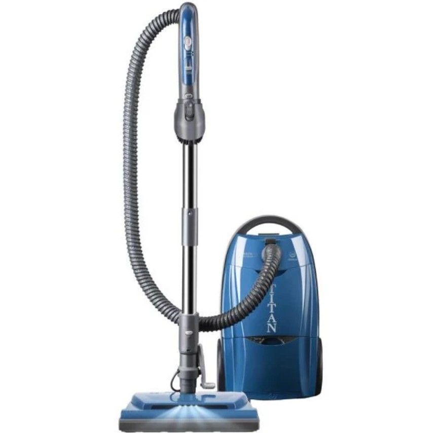 A blue vacuum cleaner with a hose attached to it