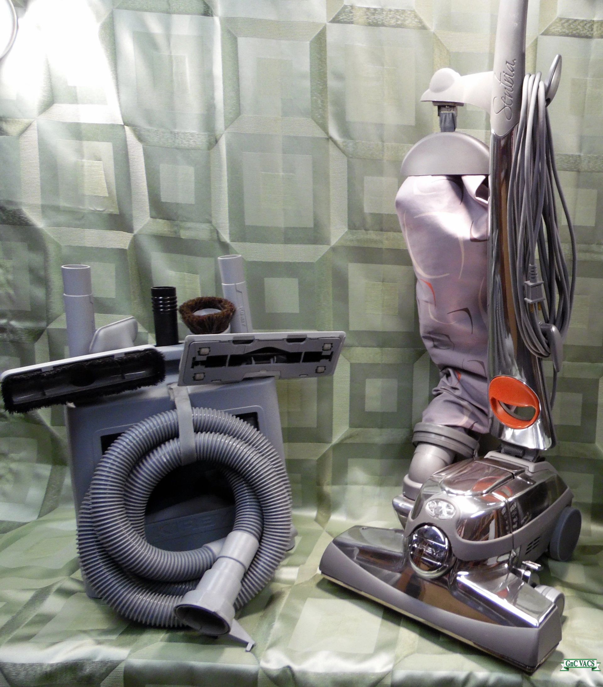 A vacuum cleaner with a hose attached to it