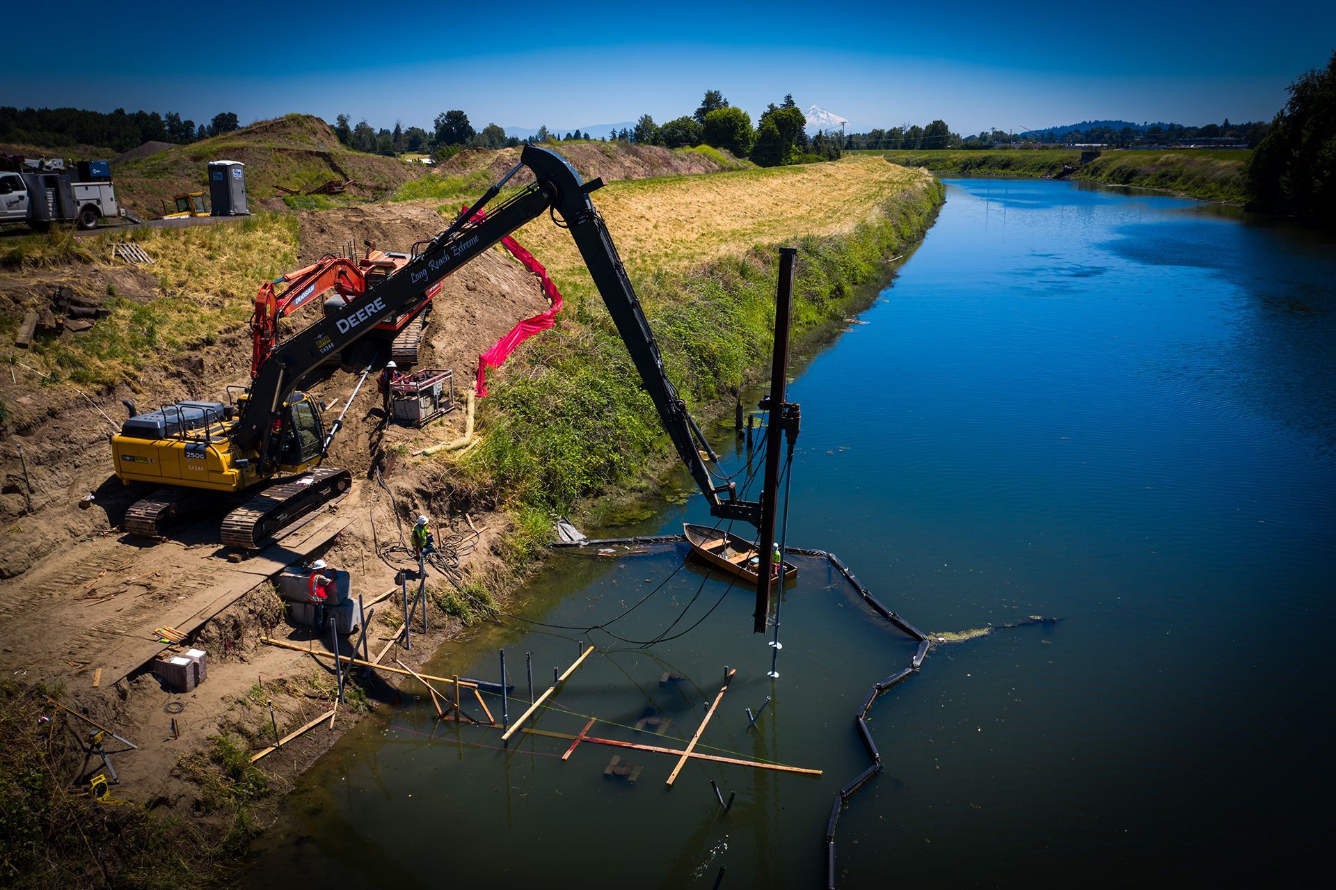 An aerial view of a construction site next to a river.
