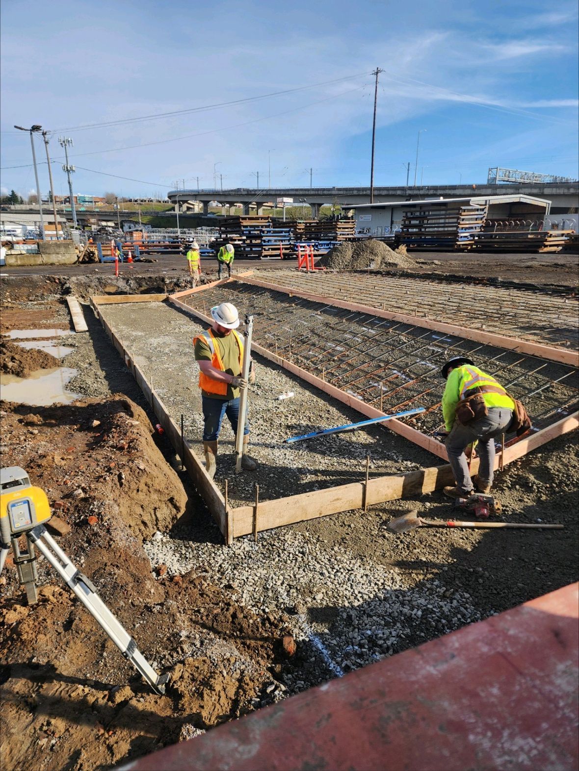 A group of construction workers are working on a construction site.
