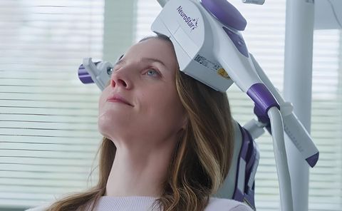 Woman doing a TMS procedure