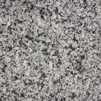 Close-up of granite surface, speckled with varying shades of gray and black.