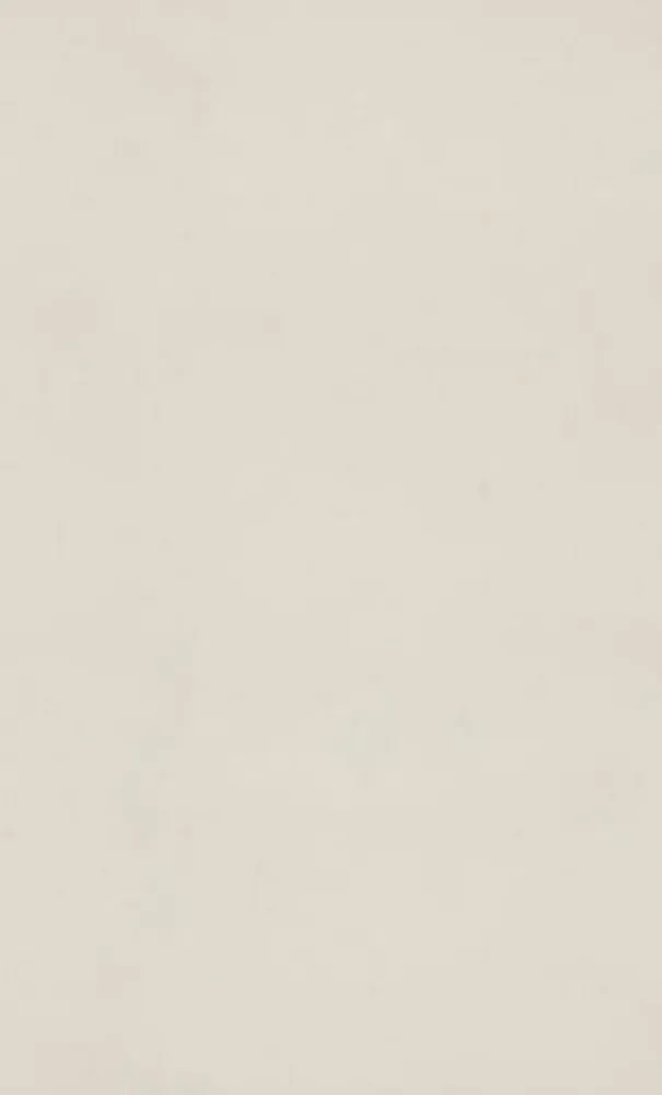 Solid, pale beige background.