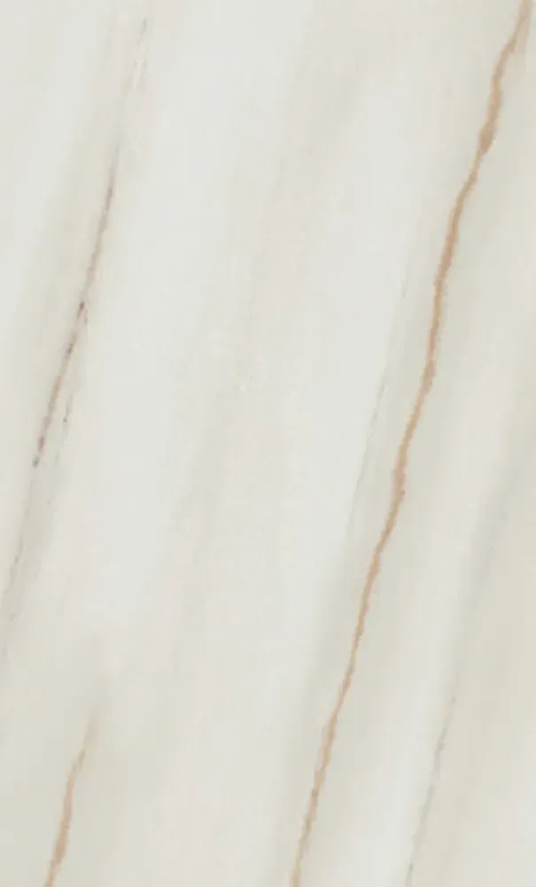 Cream-colored marble background with light brown diagonal veining.