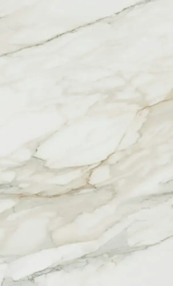 White and light beige marble pattern with flowing veining.