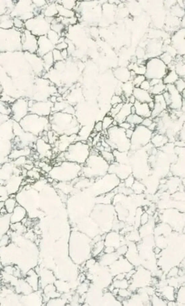 White countertop with gray-blue veining, resembling marble.