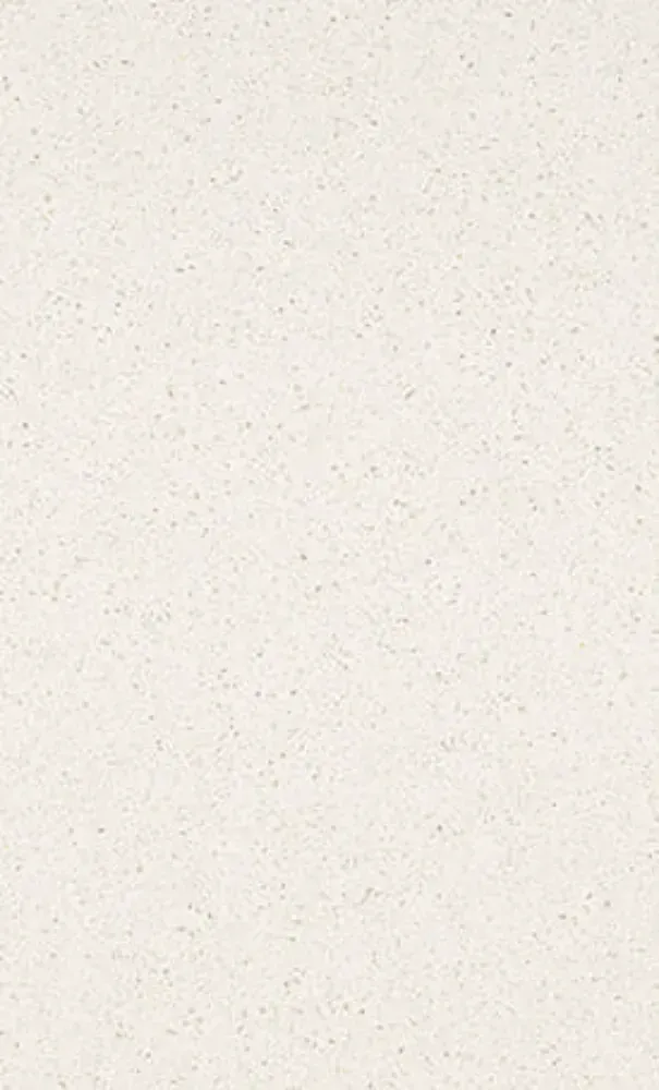 Off-white textured surface with tiny dark speckles.