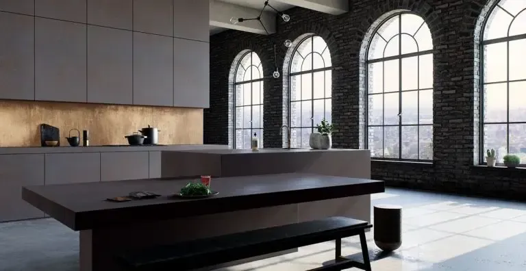 Modern kitchen with dark cabinets, brick walls, large arched windows, and a central island.