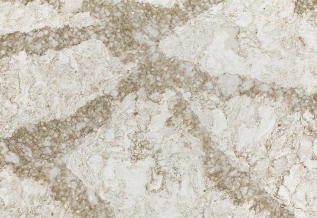 Marble-like surface with swirling tan and white patterns.