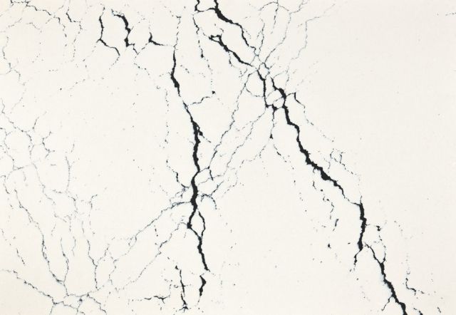 White surface with black veining resembling marble.