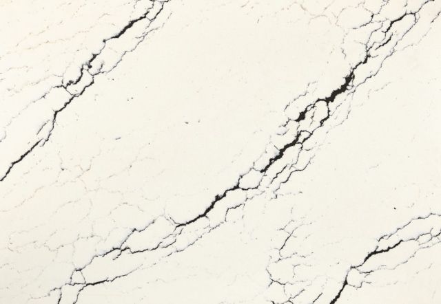 Cream-colored countertop with dark, branching veining.