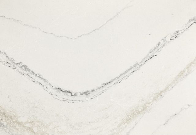 White countertop with gray and gold veining.