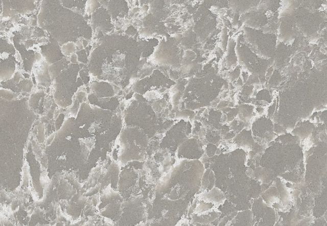 Gray and white quartz countertop with a marbled appearance.
