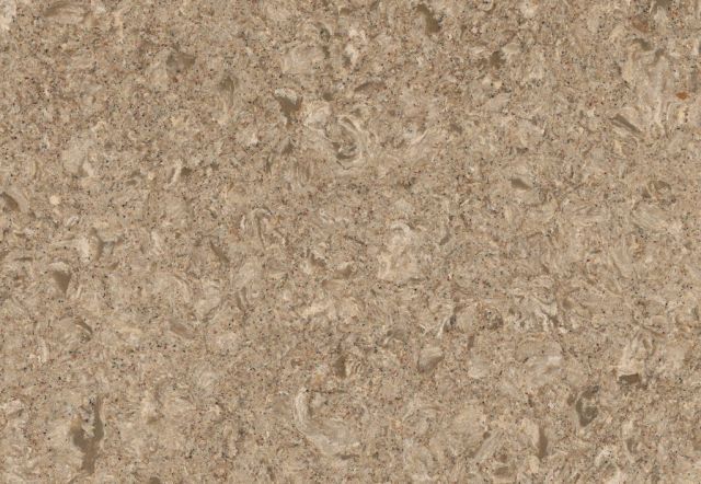 Tan and beige speckled quartz countertop surface.