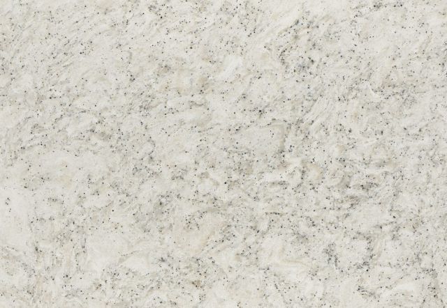 Creamy-white granite countertop with gray and black speckles and swirling patterns.