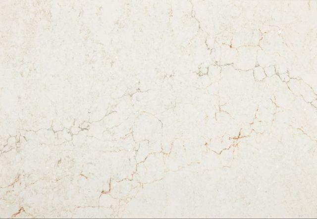 Cream-colored stone surface with subtle veining in shades of brown and tan.