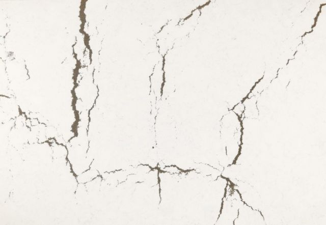 White surface with dark brown vein-like patterns, resembling cracked stone or marble.