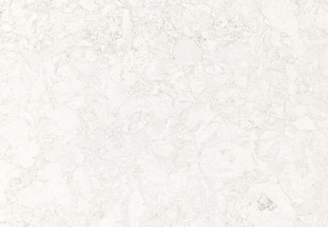 White marble surface with subtle veining and texture.