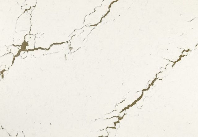 White marble surface with gold-colored veining.